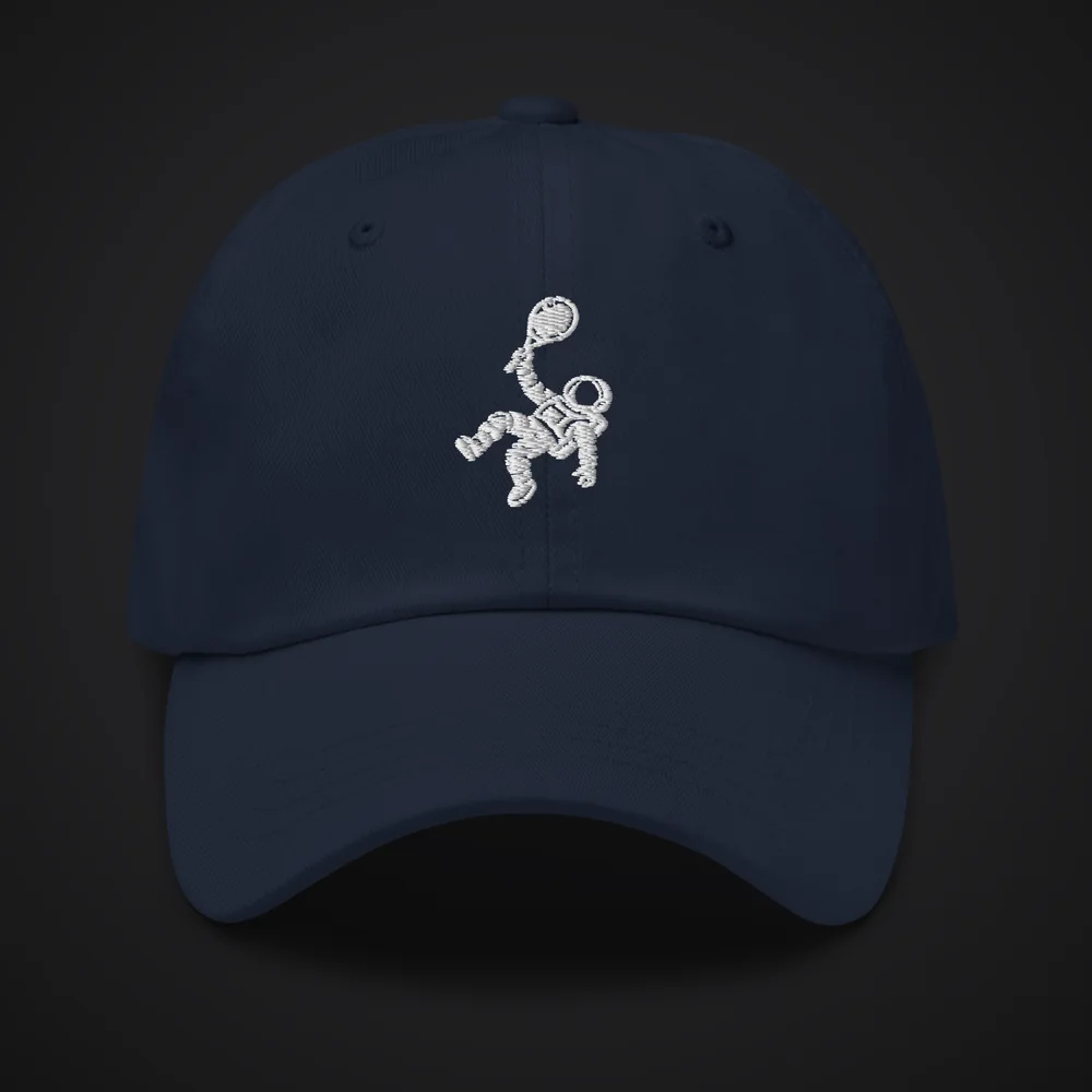 The Brave Traveler in navy with the white embroidered astronaut on the front