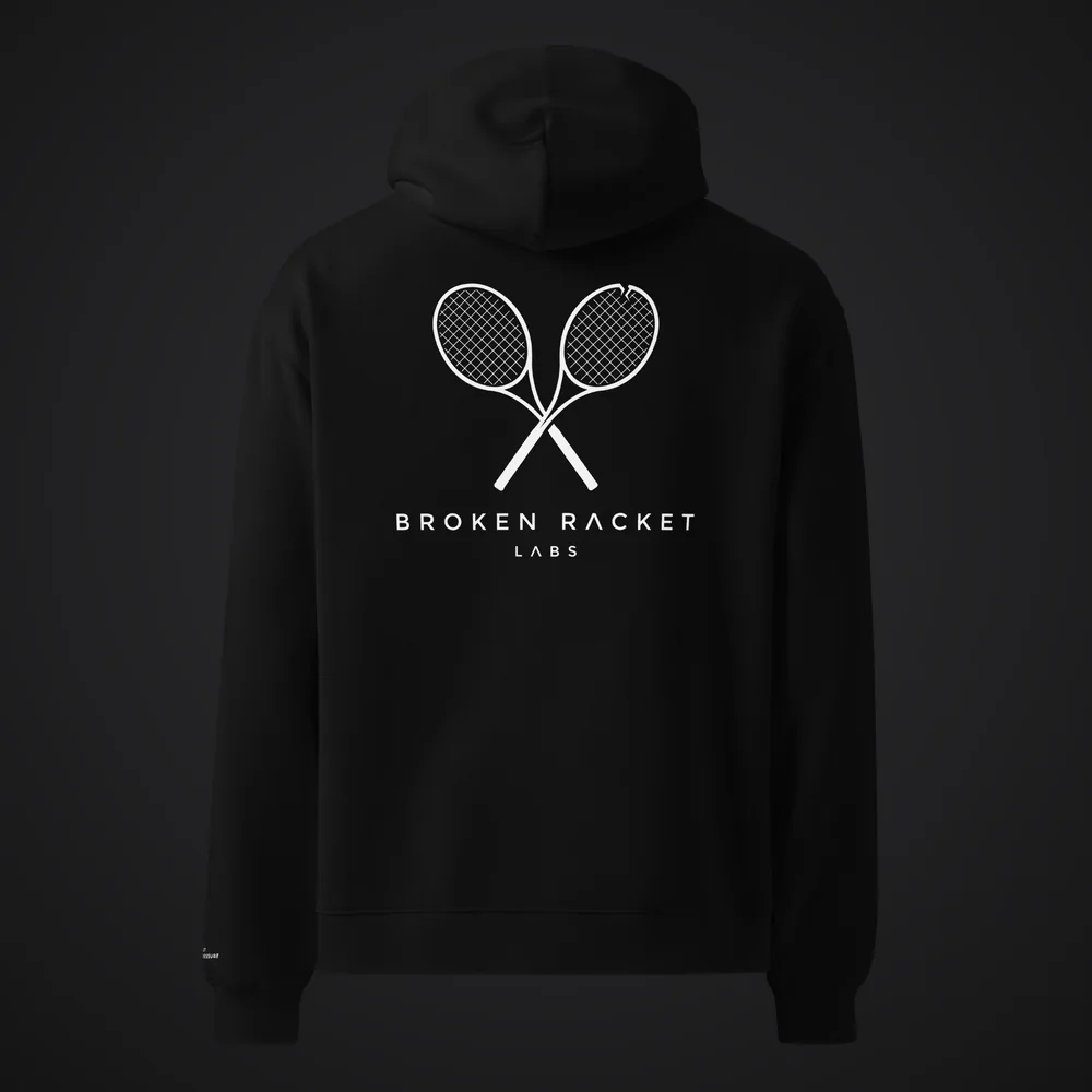 The Lab Coat in black, back, with the white Broken Racket Labs lockup